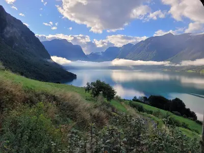 a view of a lake in a valley with mountains at Flohytta in Stryn