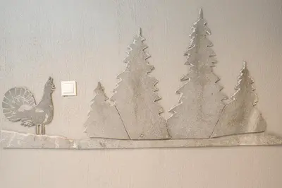 a drawing of a turkey and trees on a wall at Oppdal Gjestetun Hotell in Oppdal