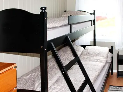 a couple of bunk beds in a room at 6 person holiday home in AVERØY in Stein