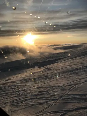 a view of the sunset from an airplane at In the middle of Trysilfjellet - Welcome Center - Apartment with 3 bedrooms - By bike arena and ski lift in Trysil