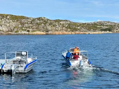 two people on a boat in the water at 6 person holiday home in Kverva in Dyrvik