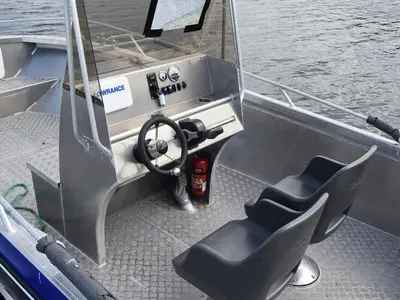 a boat with a steering wheel and a seat at 6 person holiday home in Kverva in Dyrvik