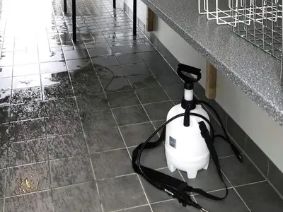a white electric vacuum sitting on a tile floor at 6 person holiday home in Kverva in Dyrvik