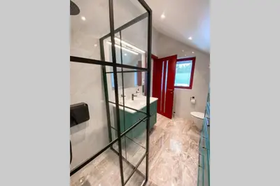 a bathroom with a sink and a mirror at Flatanger Turkish Bath apartment in Lauvsnes