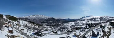 a small town covered in snow in the mountains at Panorama 13 - beautiful view! in Sogndal