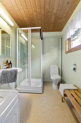 a bathroom with a shower and a toilet at Cabin alongside the beautiful fjærlandsfjord in Fjarland