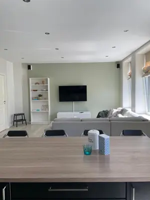a living room with a table and a couch at City Center Apartment in Ålesund