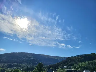 a view of a mountain with a blue sky at Nature View Apartment in Espeland in Bergen