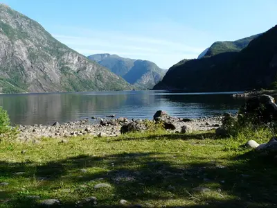 a view of a lake with mountains in the background at Kvamsdal Pensjonat 2 in Eidfjord