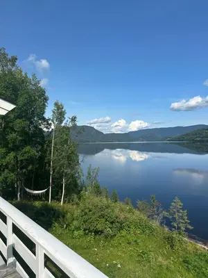 a view of a lake from a porch at Halsteinsplassen in Surteberg