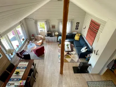 an overhead view of a living room with a blue couch at 6 person holiday home in Espevær-By Traum in Espevær