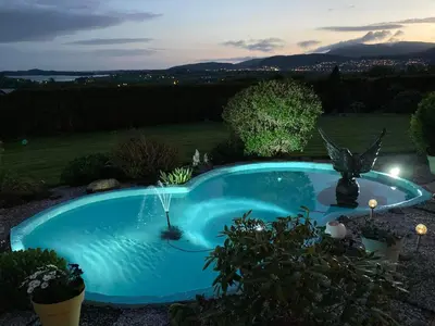 a swimming pool in the middle of a yard at Rødseth gårdsovernatting Dobbeltrom in Molde
