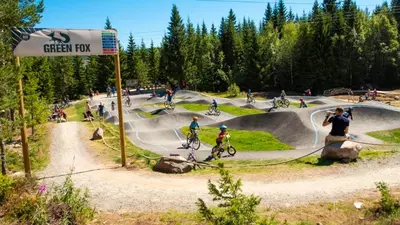 a group of people riding bikes at a skate park at In the middle of Trysil fjellet - Welcome Center - Apartment with 4 bedrooms and sauna - By bike arena and ski lift in Trysil