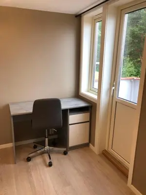 a desk in a room with a chair and a window at Atlantic Panorama Villa Kalle in Kristiansund