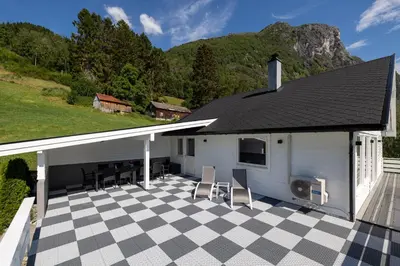 a house with a roof with a checkered floor at Flotunet - Jørnhuset in Stryn