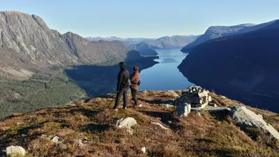 a man and woman standing on top of a mountain at Between Fjord og Glacier in Ålfoten