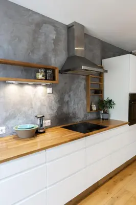 a kitchen with white cabinets and a sink at Cozy apartment in Alesund city in Ålesund