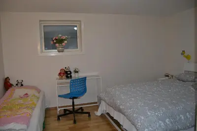 a bedroom with a bed and a desk and a chair at Totally independent apartment near NTNU,Lerkendal and Center in Trondheim
