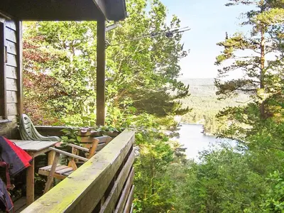 a view of a river from the porch of a house at 4 person holiday home in Reksteren-By Traum in Klinkholmen