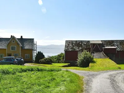 a dirt road in front of a house with a car at 6 person holiday home in FISKÅ-By Traum in Fiskå