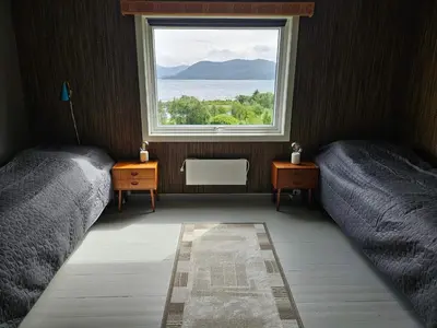 a bedroom with two beds and a window at 6 person holiday home in FISKÅ-By Traum in Fiskå