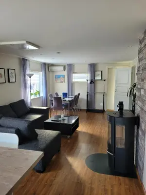a living room with a couch and a table at Espeland in Bergen