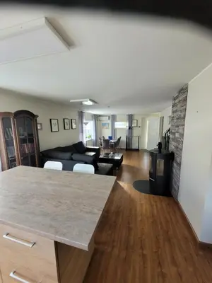 a living room with a couch and a fireplace at Espeland in Bergen