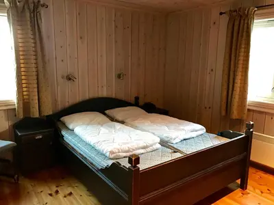 a bedroom with a bed with two pillows on it at Kirkebøen Hytter in Hemsedal