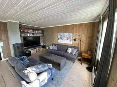 a living room with a couch and a tv at Endely - ski inn / ut in Rauland
