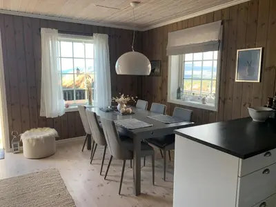 a dining room with a black table and chairs at Endely - ski inn / ut in Rauland