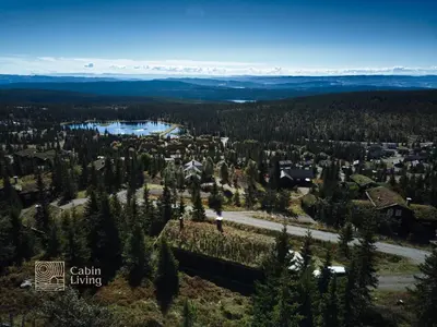 an aerial view of a town in the forest at Large cabin at Sjusjøen with sauna, fireplace, view and cross-country skiing in Ringsaker