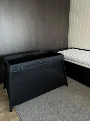 a small room with two beds and a mattress at Hjelvikhytta - flott beliggenhet ved sjøen in Hjelvik
