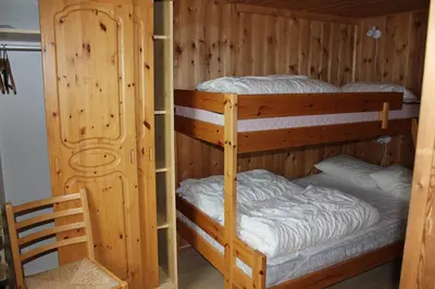 a bunk bed with two bunk beds in a room at Kvitfjell Alpinhytter Kvitfjellvegen 492 in Kvitfjell