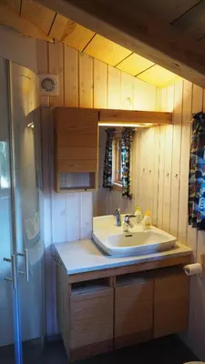 a bathroom with a sink and a mirror at Klævold utleigehytte in Klevoll