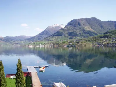 a view of a lake with mountains in the background at Fjord Apartments in Dimmelsvik