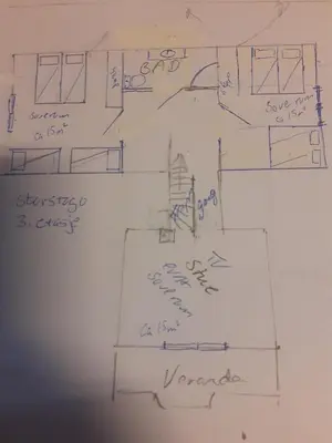 a drawing of a floor plan on a whiteboard at Beitostølen Hytter in Beitostøl