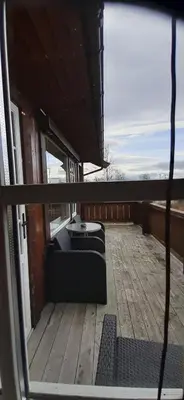 a view of a balcony with a bench on a deck at Beitostølen Hytter in Beitostøl