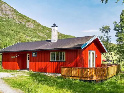 a red house with a black roof at 7 person holiday home in Hemsedal-By Traum in Hemsedal