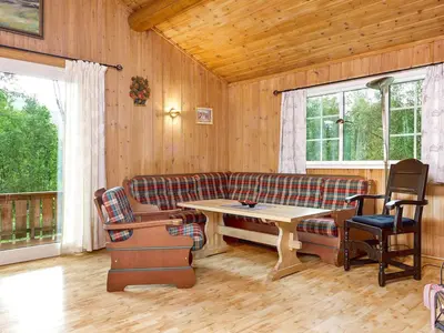 a living room with a couch and a table at 7 person holiday home in Hemsedal-By Traum in Hemsedal