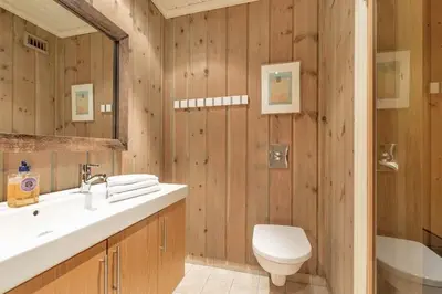 a bathroom with a sink and a toilet and a tub at Gaustablikk hytta ski-in ski-out in Gaustablikk