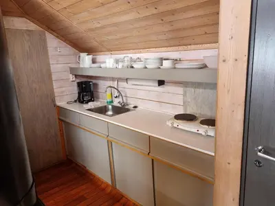 a kitchen with a sink and a counter at Kvamshaugen hytter in Luster