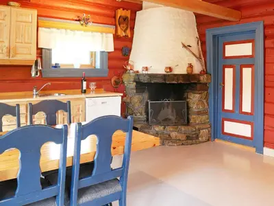 a kitchen with a stone fireplace in a house at 5 person holiday home in Hemsedal-By Traum in Hemsedal