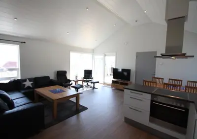 a living room with a couch and a table at Kviltorp Camping in Molde
