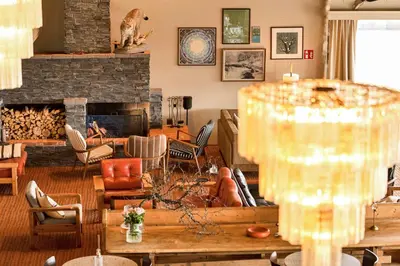a living room filled with furniture and a fireplace at Ranten Hotell Best Western Signature Collection in Nesbyen