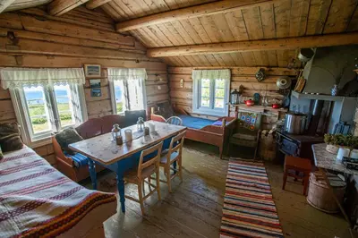 a kitchen and living room of a log cabin at Olebu in Skammestein