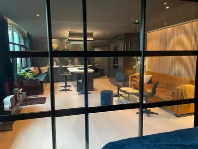a living room with a couch and a dining room at Olden apartments 2 in Stryn