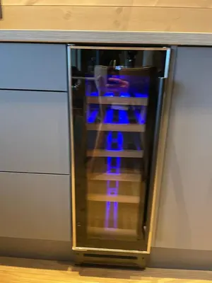 a glass cabinet with blue lights inside of it at Panorama 17 - fantastisk utsikt! in Sogndal