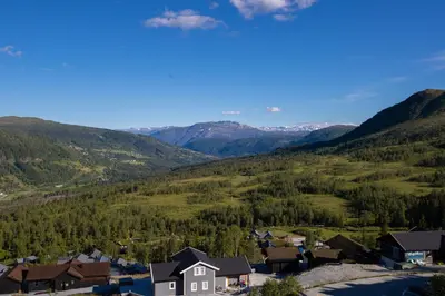 an aerial view of a small village in the mountains at Panorama 17 - fantastisk utsikt! in Sogndal