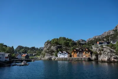 a view of a village on a body of water at Bergen/Sotra:Waterfront cabin(s).Boat.Fish.Jacuzzi in Haganes