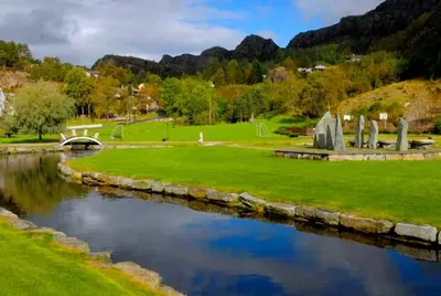 a view of a park with a river at Bergen/Sotra:Waterfront cabin(s).Boat.Fish.Jacuzzi in Haganes